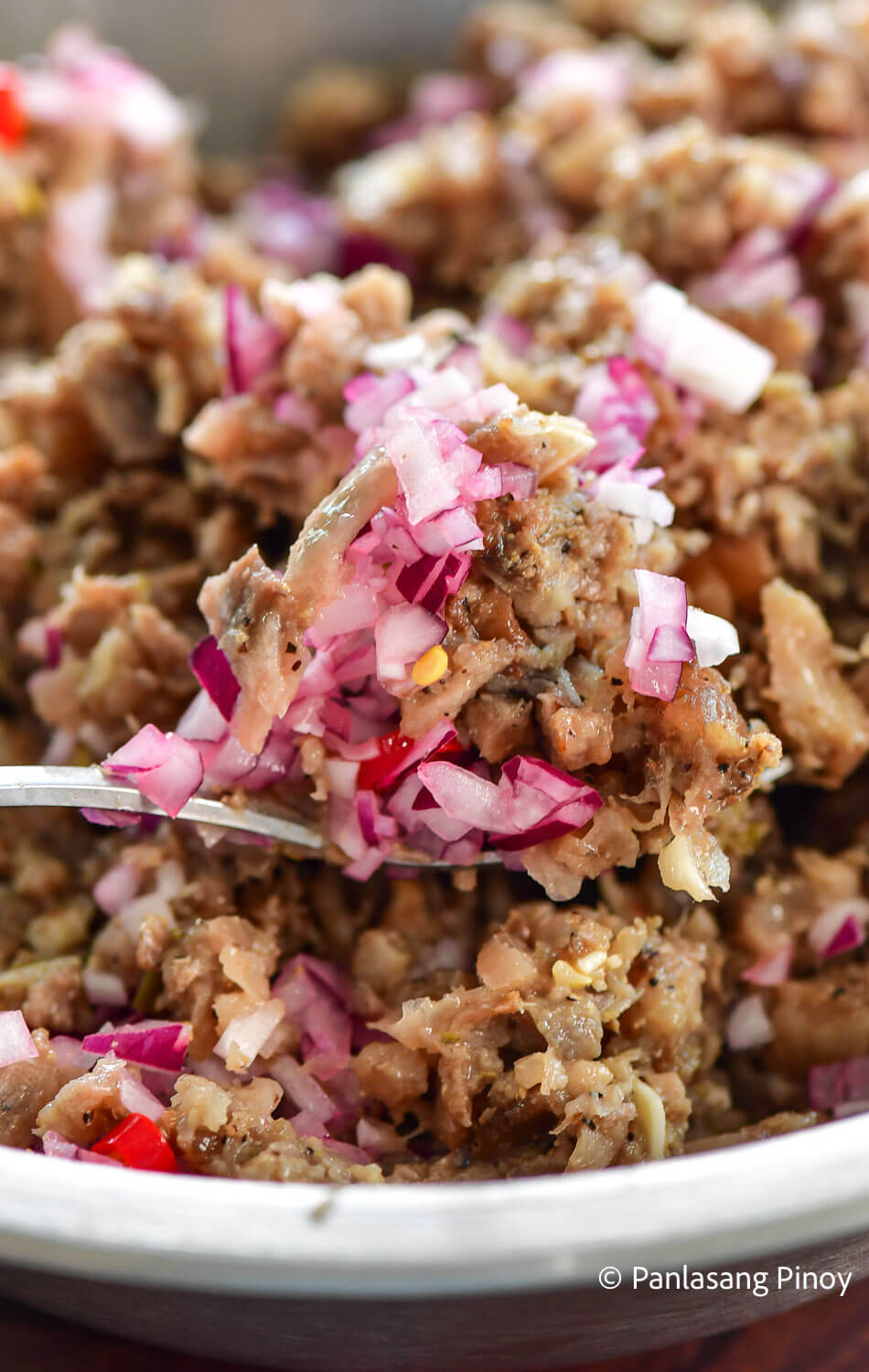 Tossing sisig ingredients